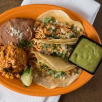 Our Signature Street Tacos · Three soft corn tortillas with onions, avocado sauce, cilantro, lime, choice of chicken or b...