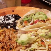 Fish Tacos · Two soft flour tortillas with a corn cabbage salsa, avocados, chipotle mayo, and grilled whi...