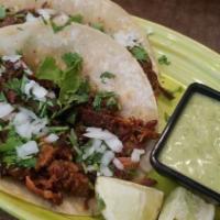 Taco · 3 tacos filled with lettuce pico de gallo shredded cheese and choice of chicken pork or beef...