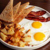 Two-Egg Breakfast · Two eggs any style served with choice of side, meat, and toast.