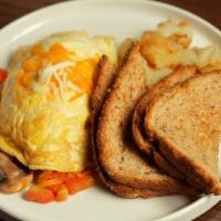 Veggie Omelet · Three-egg omelet with seasonal vegetables, mozzarella & cheddar cheeses. Your choice of side...