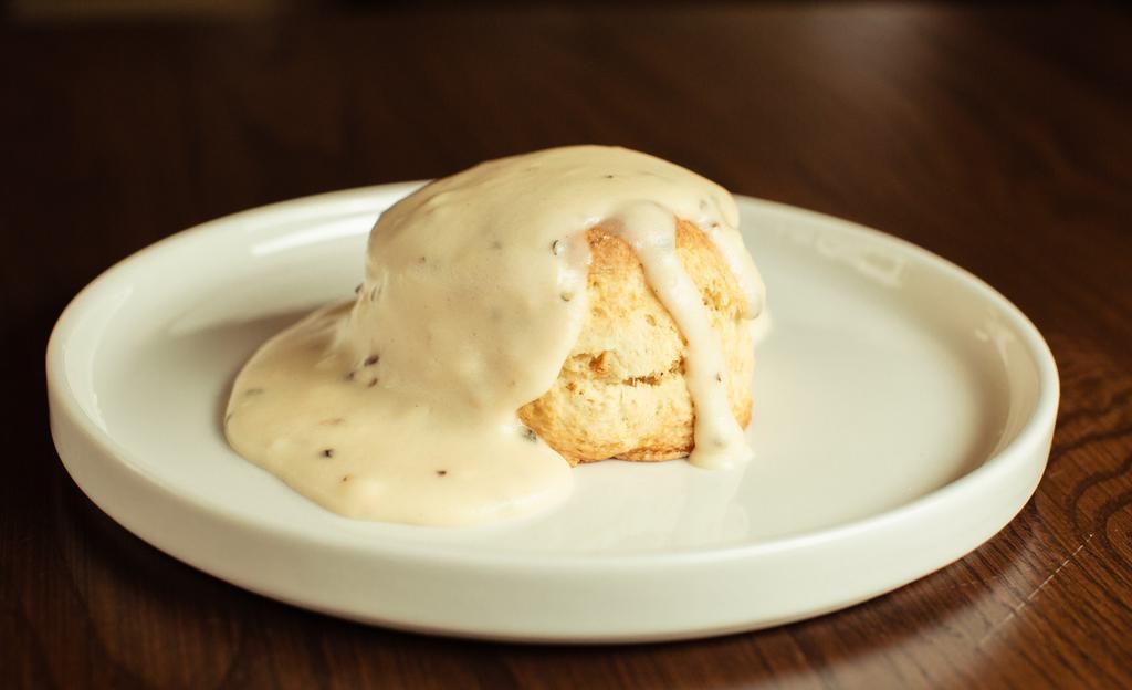 Biscuit & Gravy · Homemade biscuit topped with sausage gravy.