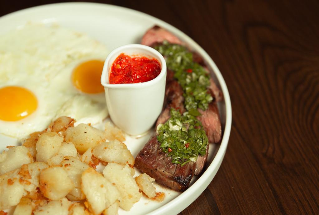 Steak & Eggs · 5 oz. strip steak with chimichurri, red salsa, breakfast potatoes, and two eggs any style.