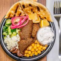 Spit Fired Gyro Bowl · Juicy, ultra seasoned spit fired Lamb or Chicken, over a bed of Lemon Pepper Basmati Rice. S...