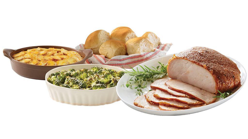 Winner, Winner, Turkey Dinner - 1/2 Smoked Turkey Breast · Serve the new Winner, Winner, Turkey Dinner any night of the week! This meal features a half Smoked Honey Baked Turkey Breast that is incredibly moist and tender. Our Turkey Breast is ready to serve, made from premium all white meat turkey and is handcrafted in store with our signature sweet and crunchy glaze. Also included with this meal are two frozen Heat & Serve side dishes - our Cheesy Potatoes au Gratin and Tuscan Broccoli (simply bake or microwave those) and a package of King's Hawaiian rolls. Serves 4.