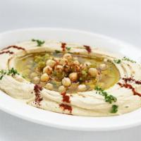 Hummus · Our famous puree of chickpeas, special spices, tahini sauce and virgin olive oil.