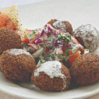 Falafel · Chickpeas mixed with our signature spices and deep fried.