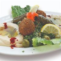 Vegetarian Combo · A platter of our famous falafel, hummus, baba ghanouj, grape leaves and tabouleh.