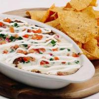 Large Nacho. · Your choice of meat, refried beans, black beans, monterey jack cheese, Yabo’s queso, pico de...