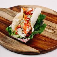 Chicken Bacon Ranch Taco. · Grilled chicken served with crispy bacon, shredded lettuce, diced tomatoes and topped with b...