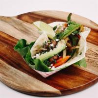 Steak Fajita Taco. · Marinated steak served with grilled onions, peppers, tomatoes, avocado slices, cilantro, fet...