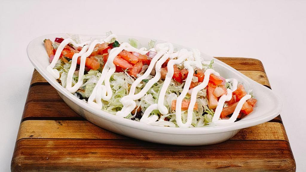 Bowl. · Baja rice and corn, black beans, shredded cheese, lettuce, pico de gallo and sour cream with your choice of protein