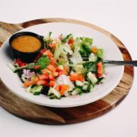 Dinky Salad. · Mixed greens with red onions, tomatoes  and cucumber with your choice of dressing. *Gluten f...