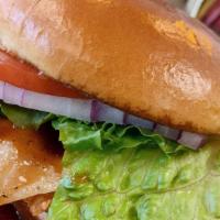 Fried Honey Bbq Chicken Sandwich · Hand breaded chicken breast deep fried, covered with honey BBQ sauce, and Swiss cheese on a ...