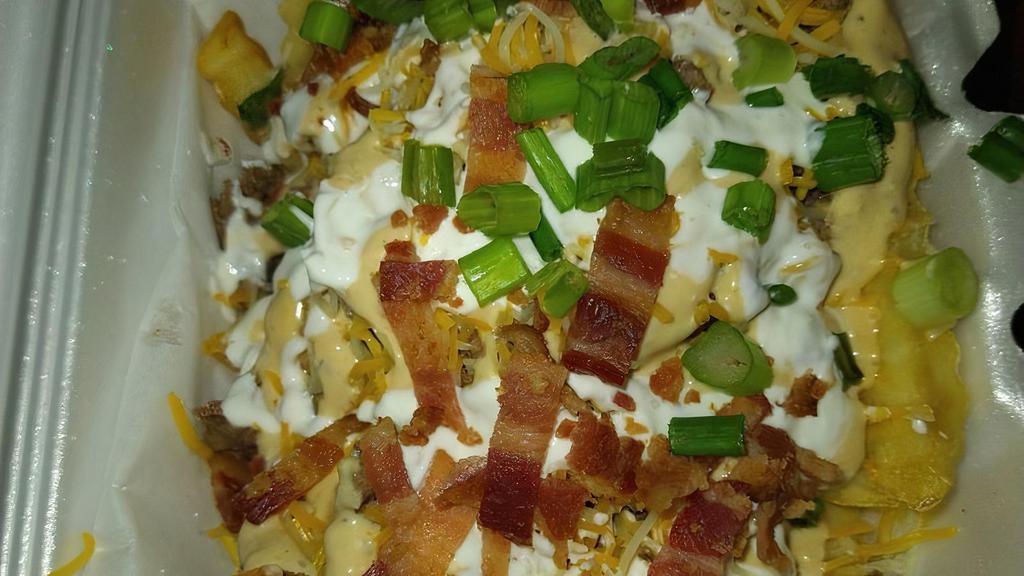 Dirty Fries · French fries with brisket, bacon, shredded cheese, green onions, sour cream, dirty sauce and jalapenos