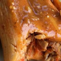 Tamales · Dough wrapped around a filling and steamed in a corn husk or banana leaf.