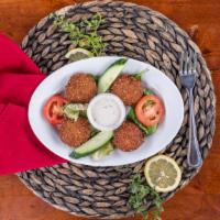 Falafel · Vegetarian. Croquette of chickpeas flavored with garlic, parsley and cilantro. Served with t...