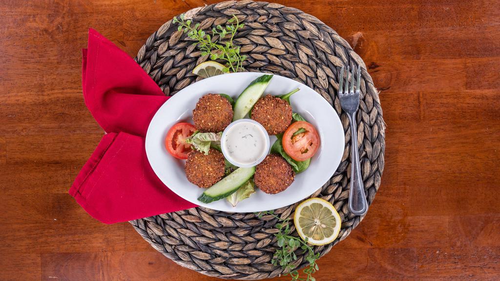 Falafel · Vegetarian. Croquette of chickpeas flavored with garlic, parsley and cilantro. Served with tahini sauce.