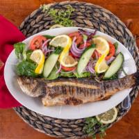 Grilled Whole Fish · Bronzini grilled over an open flame, served with mixed green salad tossed with olive oil and...