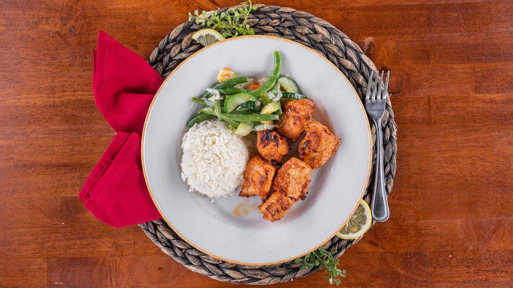 Chicken Kebab · Cubes of chicken marinated in our special sauce and grilled on flat skewers.