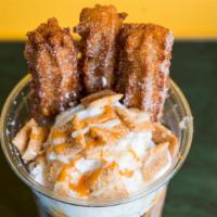Churro Sundae · Two scoops icecream churos, whipped cream, cinnamon crunch caramel and a sweet drizzle.