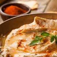 Hummus Tadka With Naan · Hummus dip with tadka (tempering with Indian spices).