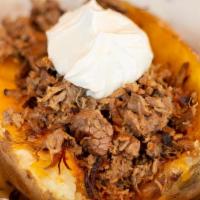 Smoked Idaho Potato · A giant seasoned potato loaded with butter, sour cream, and cheese. Your choice of chopped b...
