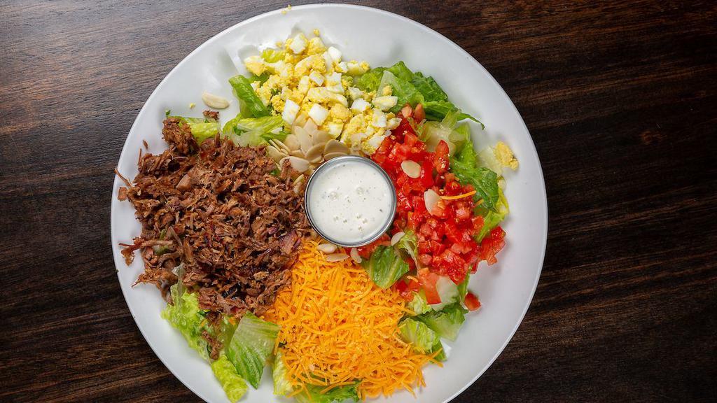 Gs Louise Salad · Chopped romaine lettuce mix with your choice of chopped brisket, pulled pork, or smoked turkey. Topped with tomatoes, sliced almonds, egg, cheese, red onion, and dressing.