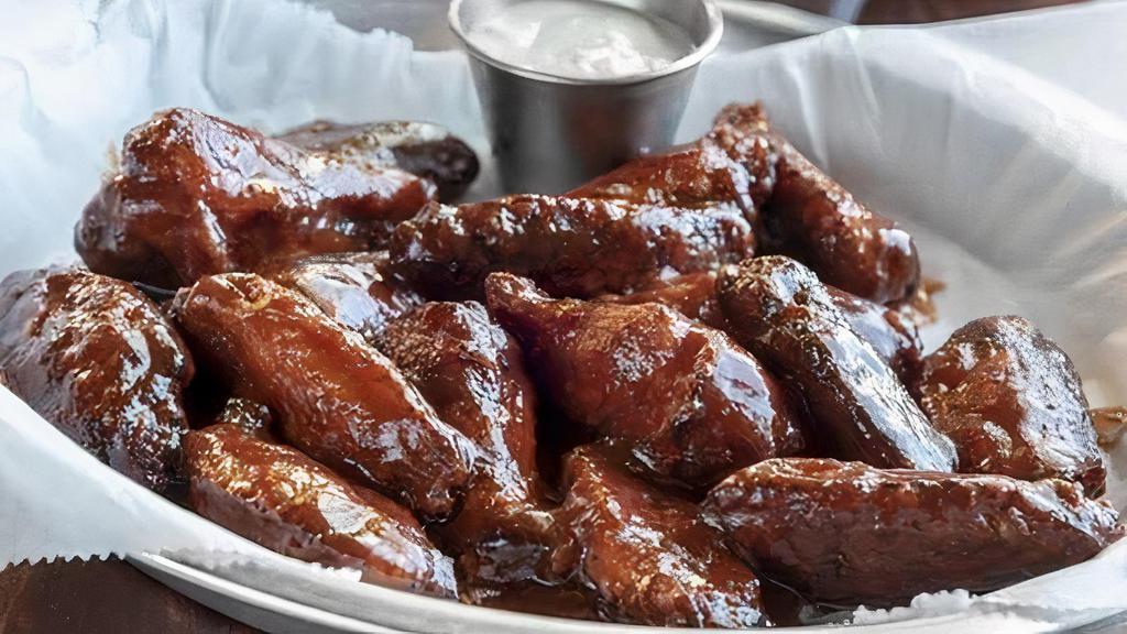Smoked Chicken Wings · Six pieces. Wings seasoned with Gs rub, slow smoked, and tossed in your choice of sweet, hot, or roughneck sauce, sriracha,  and lemon pepper.