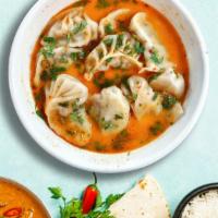 Pursuit Of Jhol · Your choice of vegetarian or chicken jhol momo, served hot.