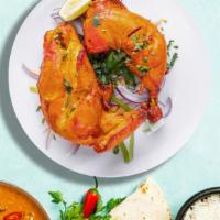 Fundoori Chicken  · Fresh chicken legs and thigh, marinated in our special housemade tandoori masala, lemon juic...