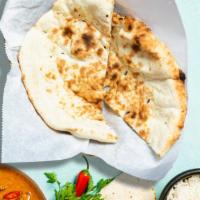 Classic Naan  · Traditional Indian grilled bread made of flour, milk, water, salt and baking powder.
