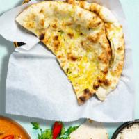 Next To Naan · Indian grilled bread made of flour, American cheese, and milk, topped with butter.
