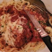 Chicken Parmigiana · Chicken breast, breaded and baked with mozzarella cheese and marinara served with spaghetti.