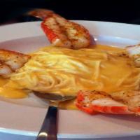 Colossal Shrimp · Four huge shrimp broiled with our special seasonings and served over angel hair pasta with l...