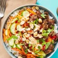 Sriracha Steak Bowl · Grilled sirloin, oven roasted broccoli and carrots, grilled onions, mushrooms, green pepper,...