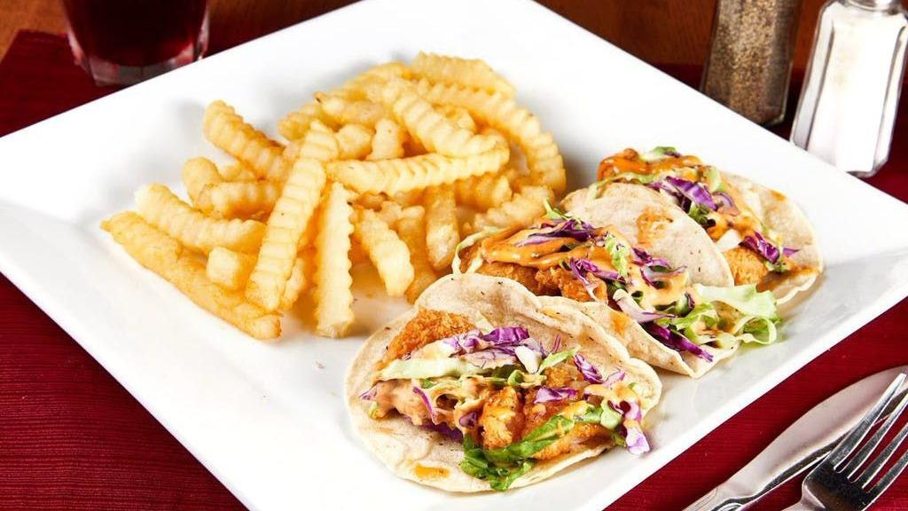 Yacht Club Tacos · (Order of 3) Breaded shrimp or fish served atop a corn tortilla. Topped with chipotle sauce and shredded cabbage. Served with a side of your choice.