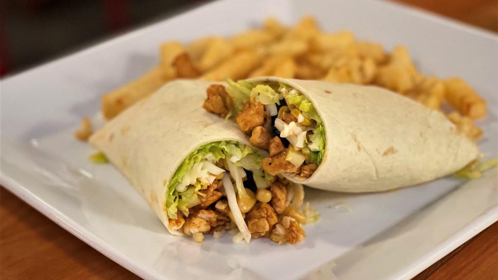 Burrito Rancho · A large flour tortilla burrito stuffed w/ shredded white cheese, romaine lettuce, corn, cucumber, al pastor sauce, and your choice of grilled chicken or steak. Served with a side of your choice.
