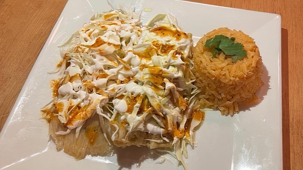 Tamales Meal · (Order of 2) In-house made tamales made stuffed with the filling of your choice topped with cabbage and sour cream. Served with Mexican rice.