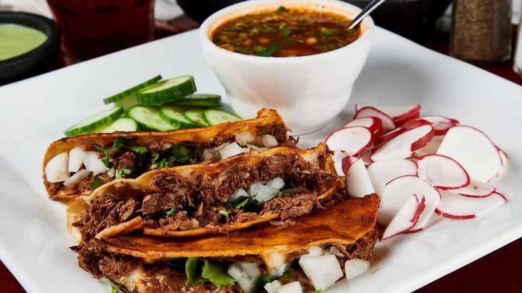 Quesa-Tacos · (Order of 3) Cheese and birria meat atop a toasted corn tortilla. Topped with onion and cilantro. Served with a side of chicken broth.