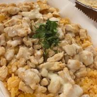 Queso-Pollo · Grilled chicken over a bed of rice, covered in  white  cheese dip.