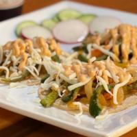 Vegetarian Tacos Poblanos · Fried poblano pepper, sauteed onions  and tomato topped with white shredded cheese and chipo...