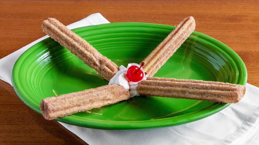 Mexican Churros · filled with cream and coated with cinnamon-sugar.