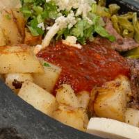 Bistec Al Molcajete · Pan-fried beef steak sautéed in caramelized onions with tomatoes, jalapeño peppers, potatoes...
