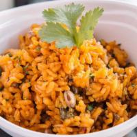 Arroz Con Gandules · A bowl of our traditional Puerto Rican rice made from scratch every day with fresh ingredien...