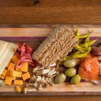Charcuterie Board · market cheese, cured meats, pickled vegetables, jams and accouterments. Served with crackers.