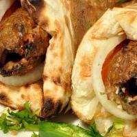 Kebab Roll Chicken Sandwich · Kofta kabab rolled in fresh tandoori naan bread with sauce and salad