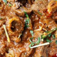 Goat Karahi · Prepared with onions, tomatoes, and green chilies.