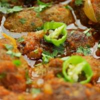 Kabab Karahi · Tandoori kabab cooked with tomatoes, cilantro, and herbs.