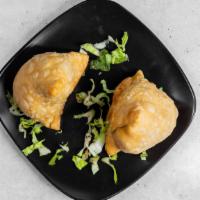 Beef Samosa · Ground broiled beef blended with cumin and coriander stuffed into a crispy pastry.